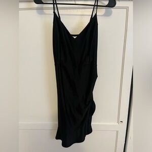 Stretchy black spaghetti strapped dress. Size M